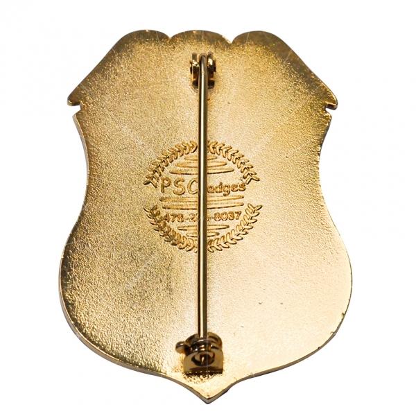 Gold plated officer badge