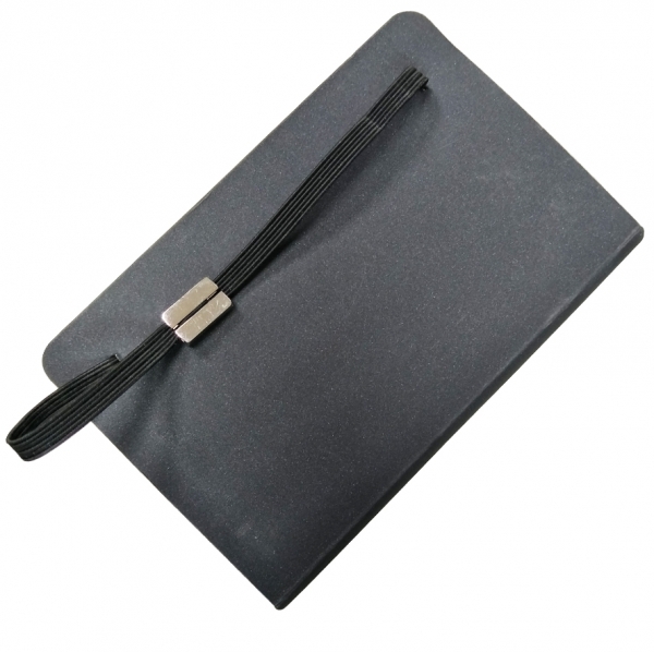 notebook with elastic band and plaque